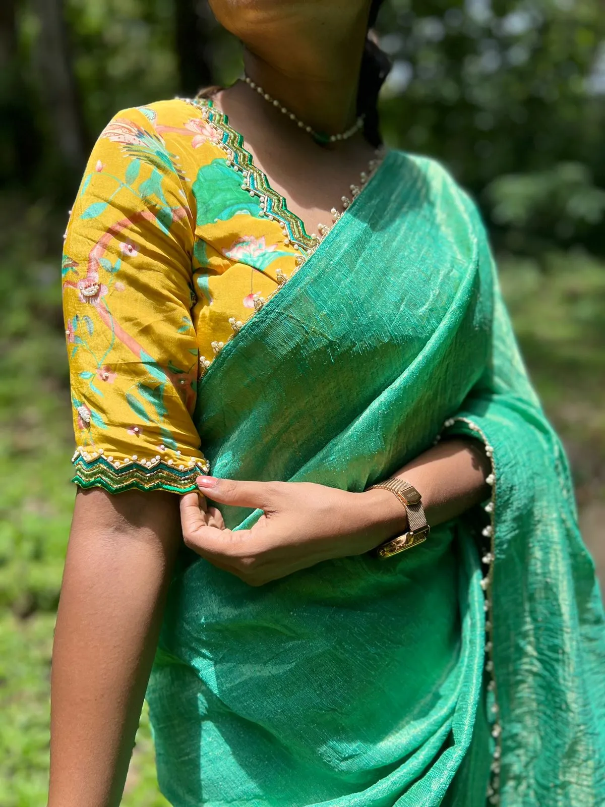 Green tissue saree with yellow floral hand worked blouse