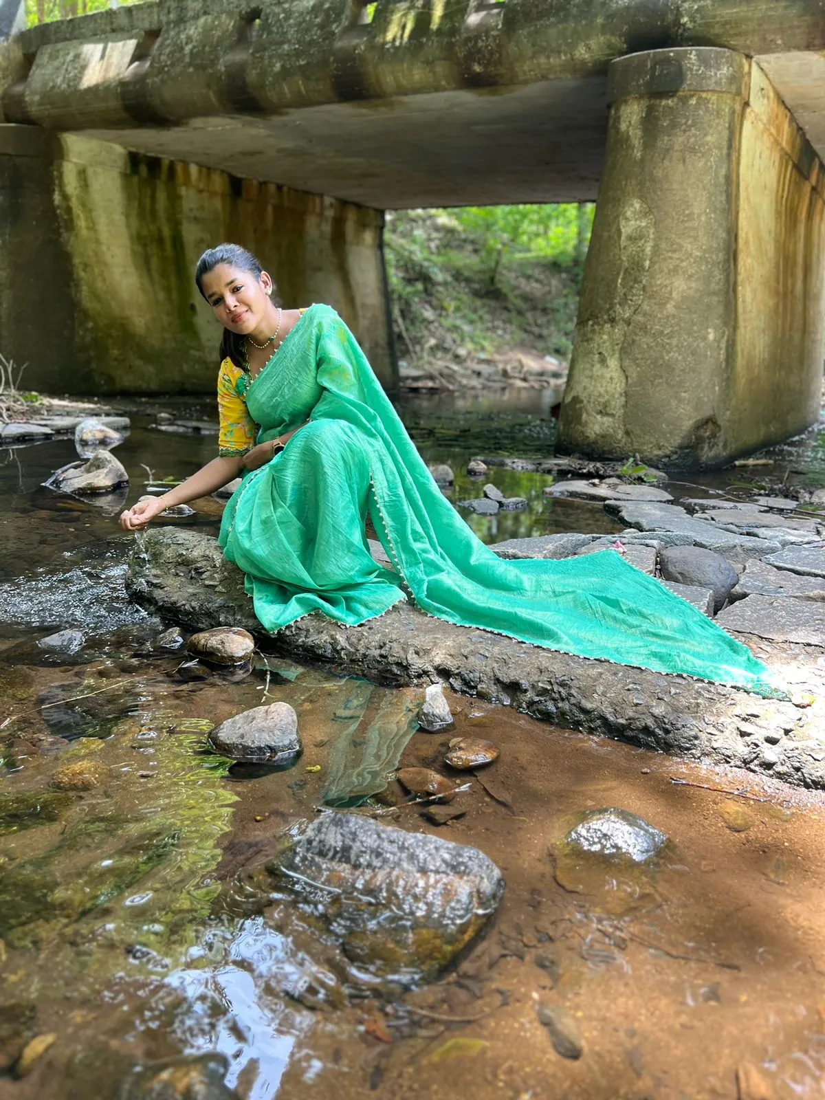 Green tissue saree with yellow floral hand worked blouse