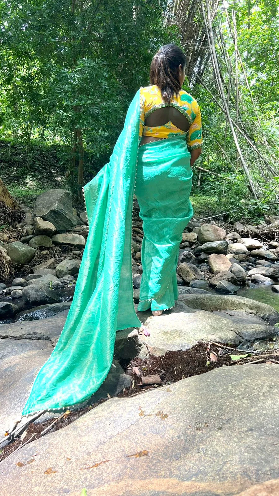 Green tissue saree with yellow floral hand worked blouse