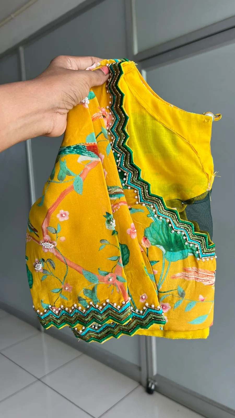 Green tissue saree with yellow floral hand worked blouse