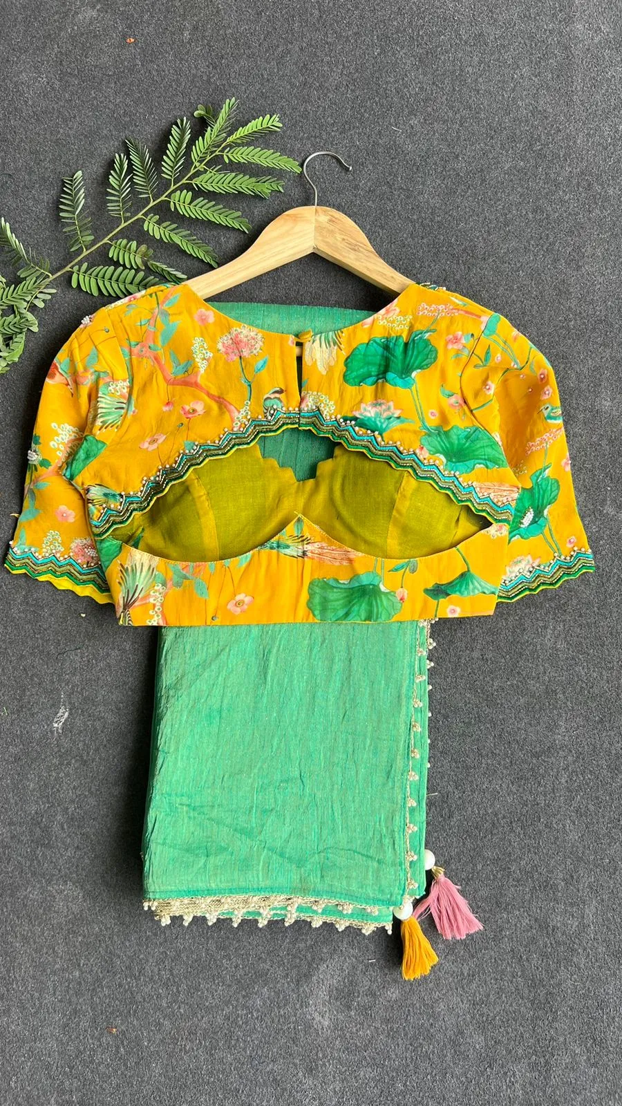 Green tissue saree with yellow floral hand worked blouse