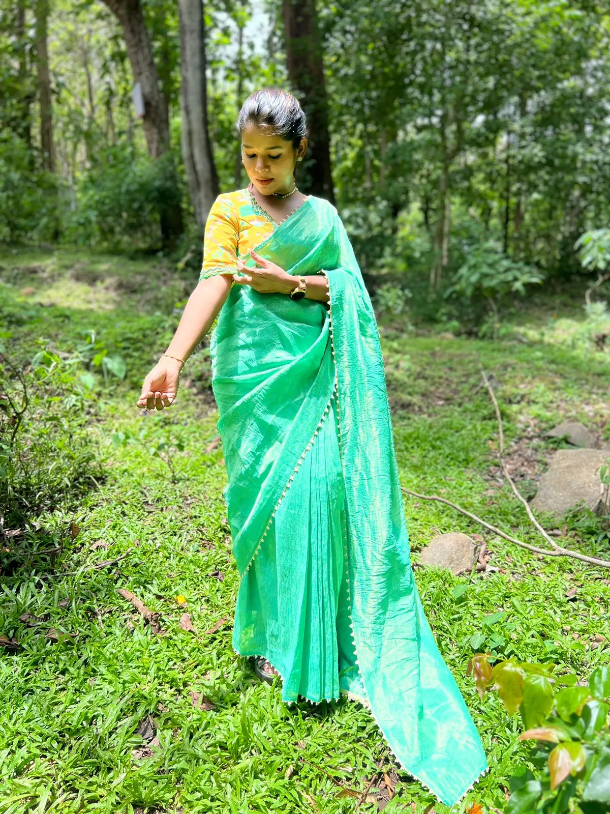 Green tissue saree with yellow floral hand worked blouse